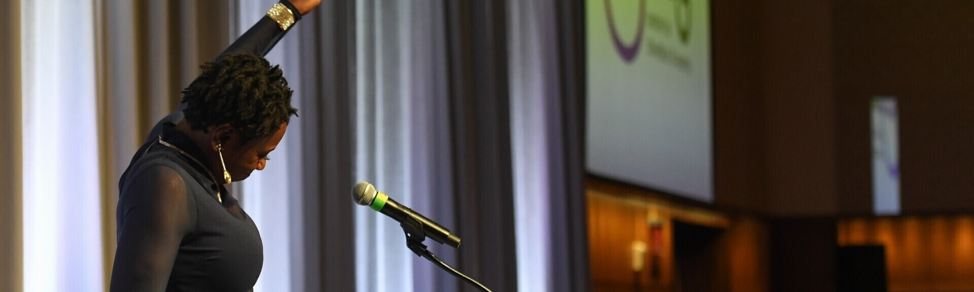 Speaker at 2022 gala raises hand in the air